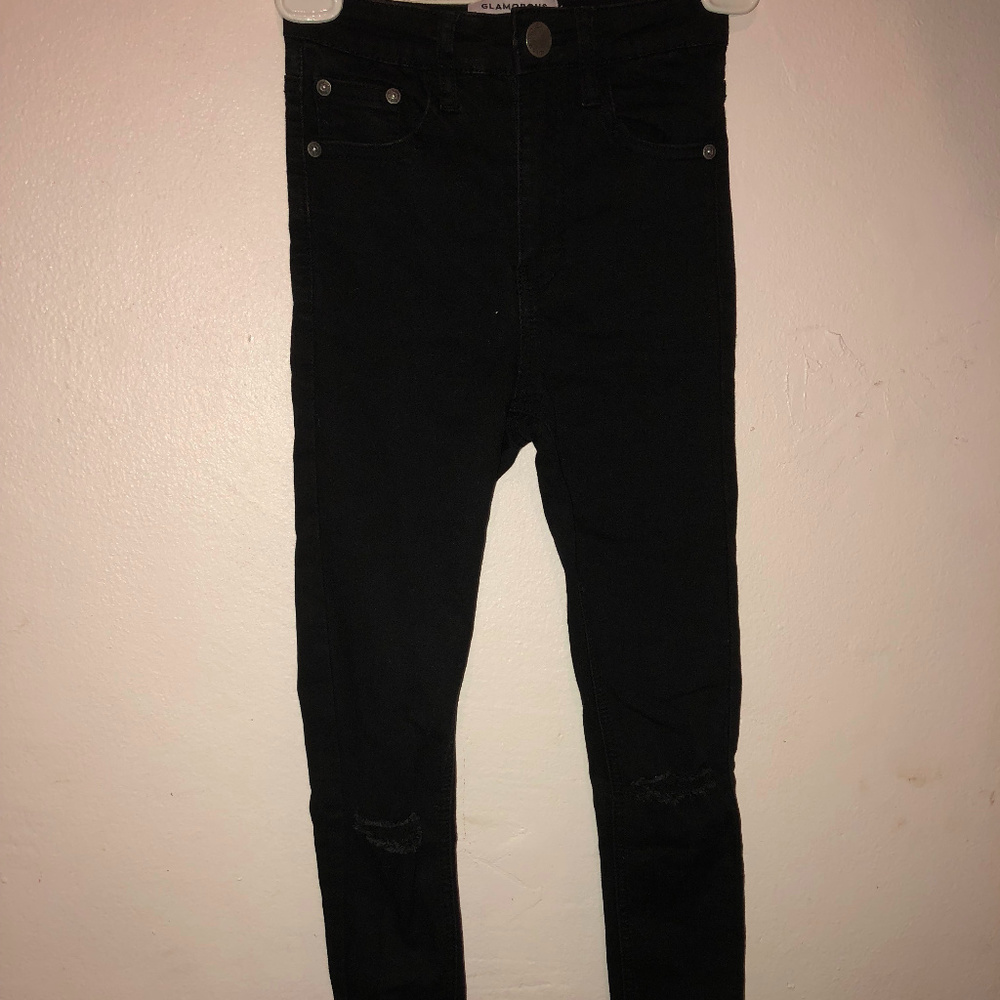 High-waisted ripped black jeans
